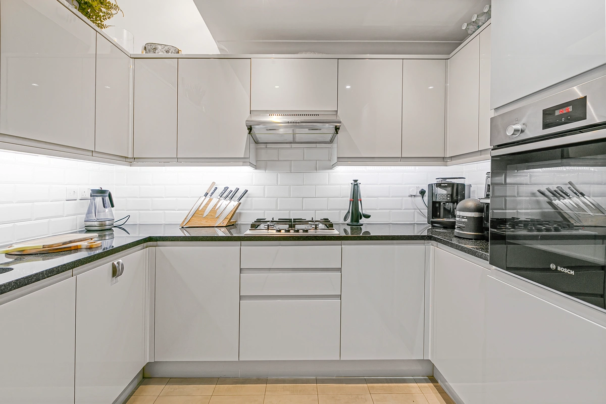 Fully equipped kitchen with modern appliances and sleek finishes