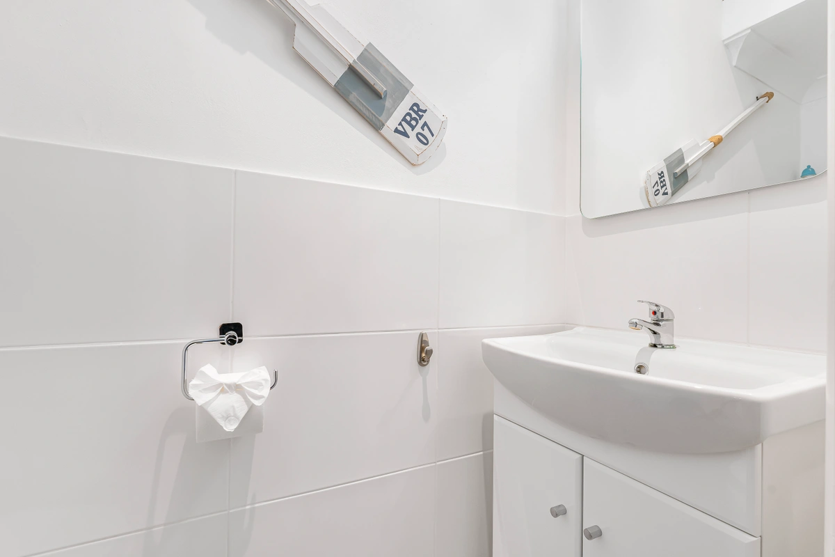 Elegant bathroom with marble finishes and a large walk-in shower