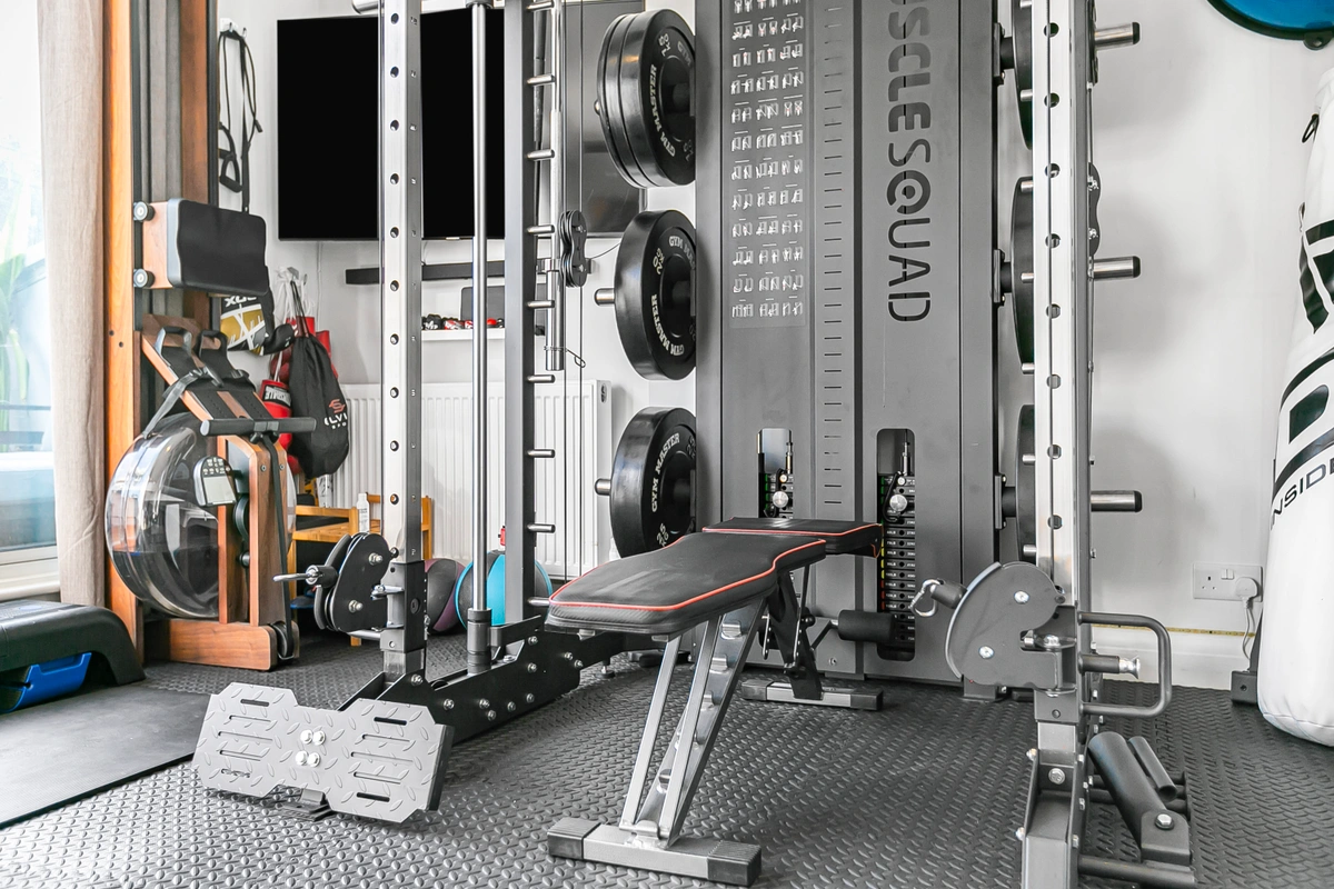 Modern home gym featuring a variety of fitness equipment and open spacePrivate home gym at Casa Cribs with modern equipment for an active lifestyle.