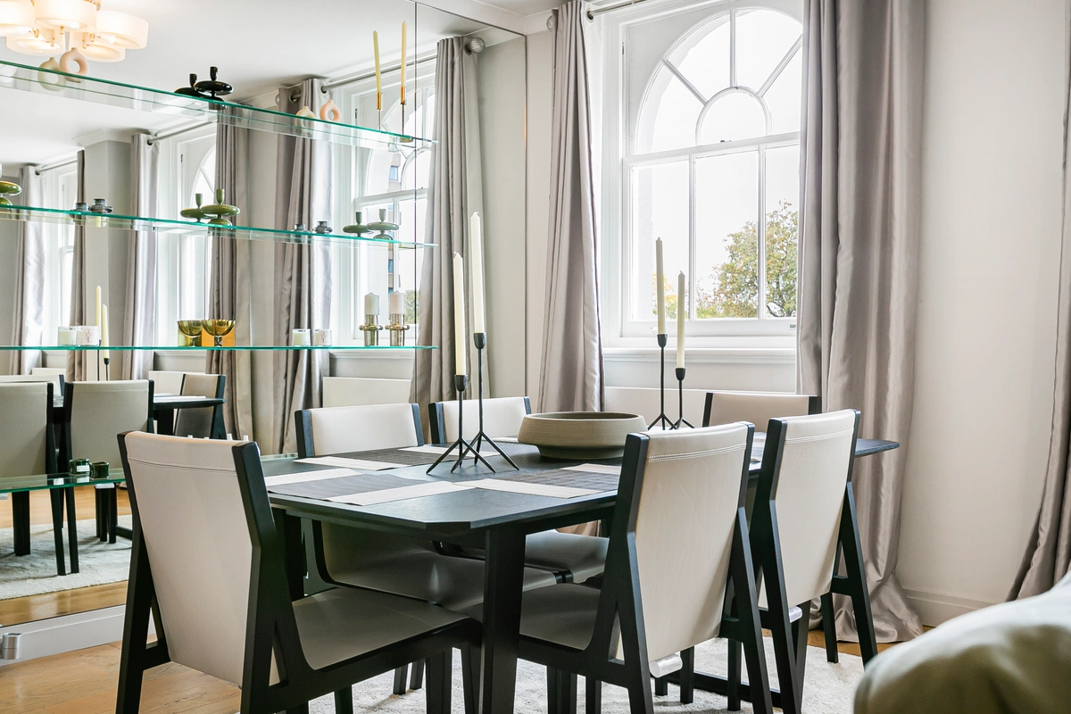 Modern dining setup with elegant tableware and ambient lighting