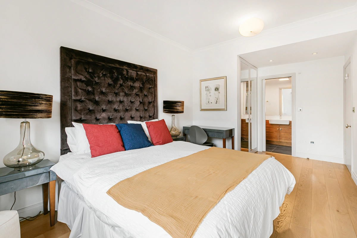 Secondary bedroom featuring elegant textiles and natural light