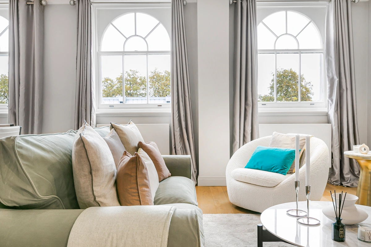 Elegant living room with expansive windows and designer furnishings