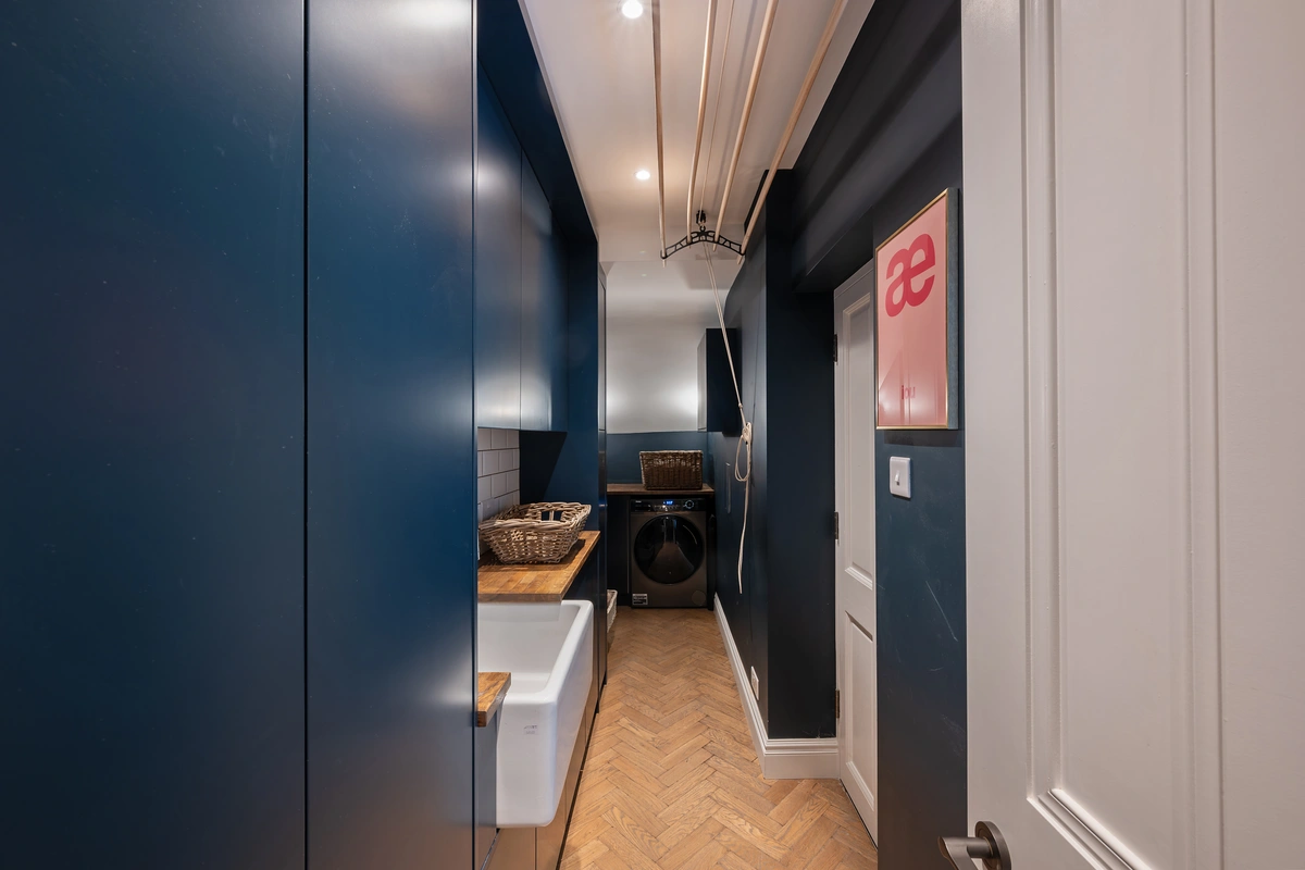 Well-lit corridor with smooth flooring and neutral tones