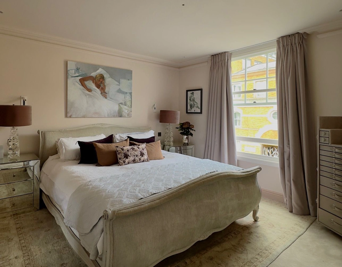 Spacious bedroom with double bed and elegant furnishings