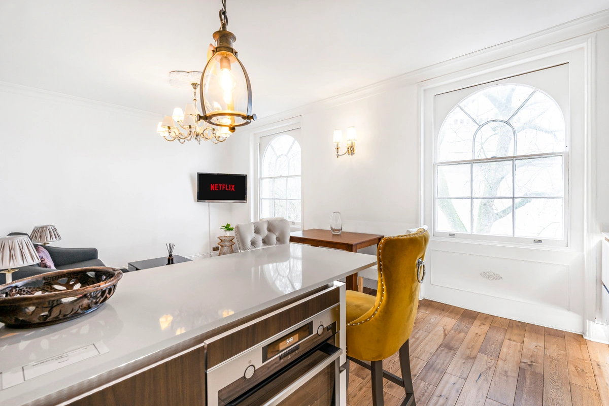 Sleek kitchen area with high-end fittings and natural lighting