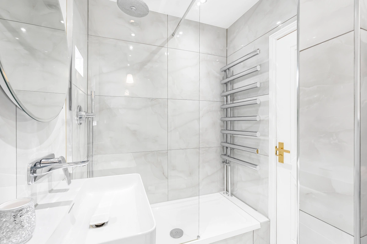 Luxurious marble bathroom with rainfall shower and spa-like features