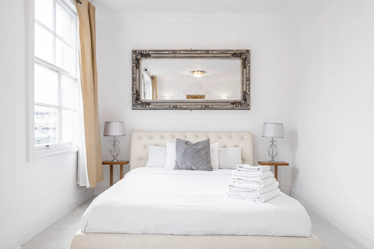 Elegant bedroom with king-sized bed and soft lighting