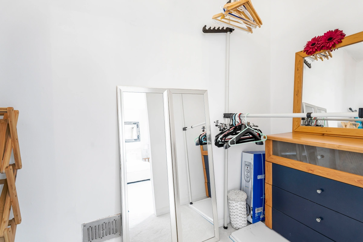 Wide-angle view of open-plan living and kitchen area