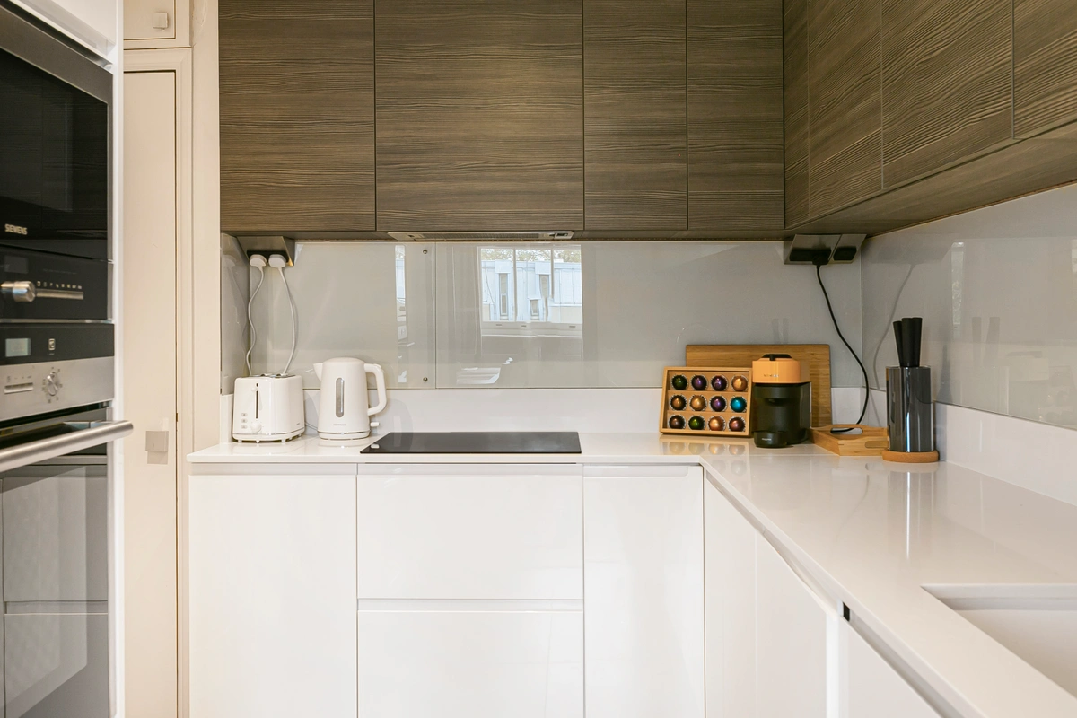 Modern kitchen with high-end appliances and sleek marble surfaces