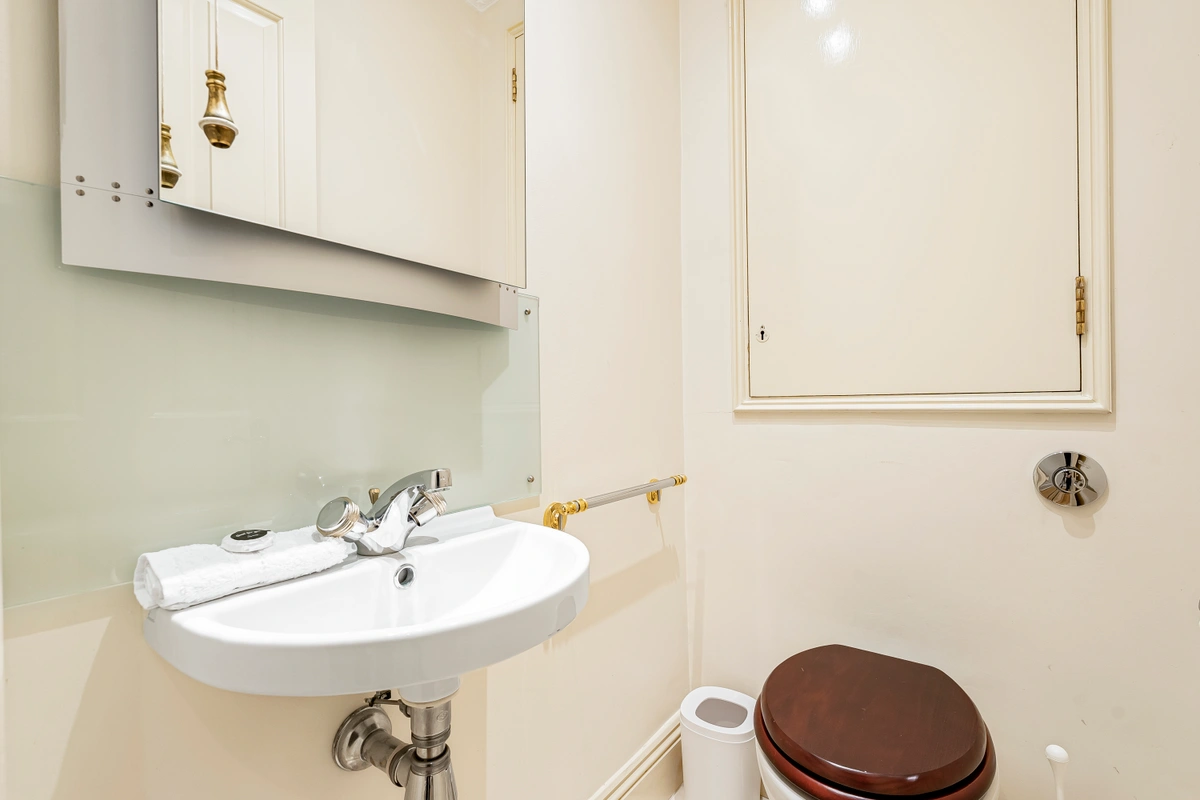 Modern bathroom with glass shower and marble finishes