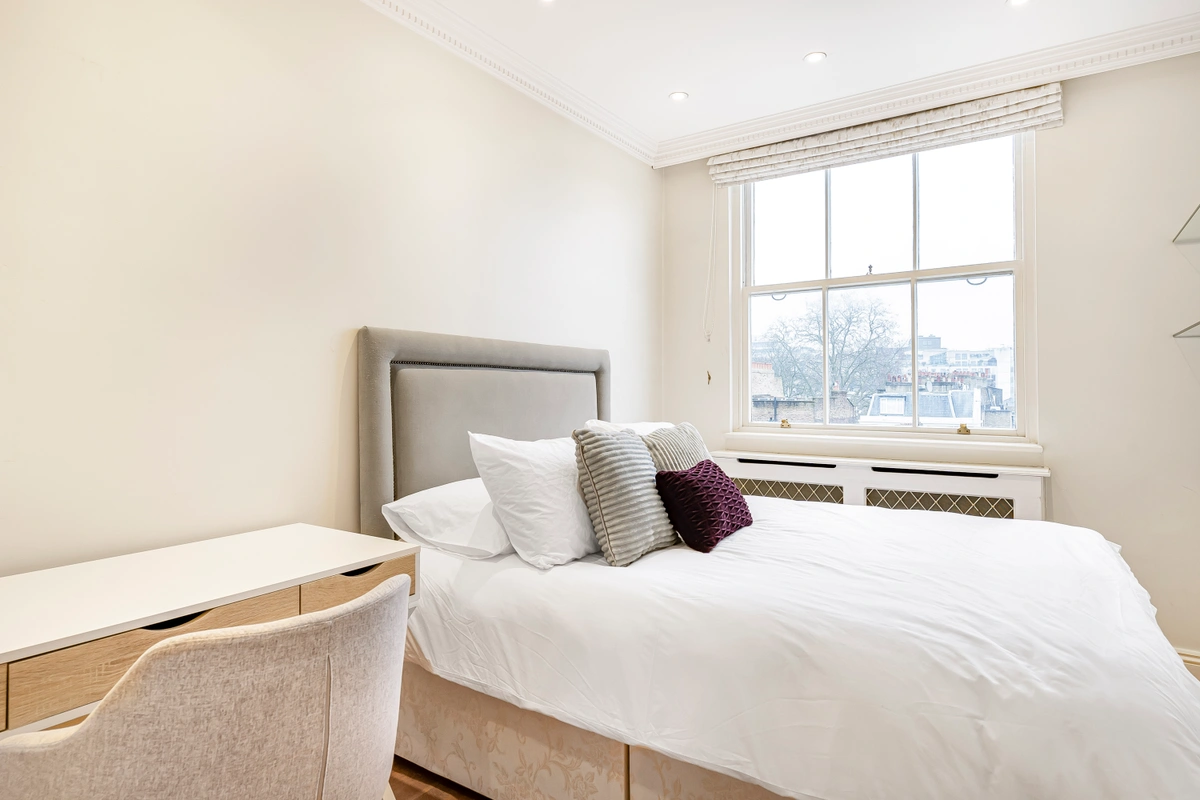 Refined bedroom with a large bed and tasteful decorations