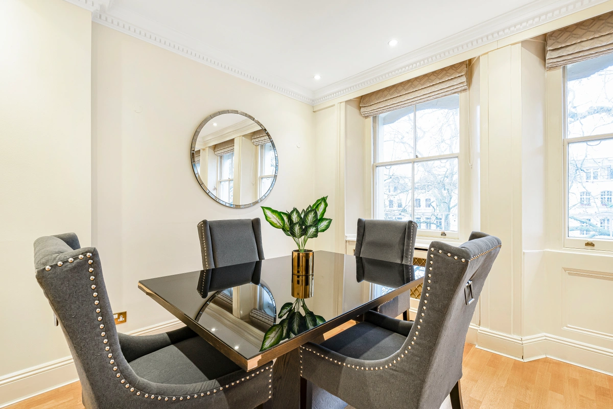 Dining area with a modern table and sophisticated tableware