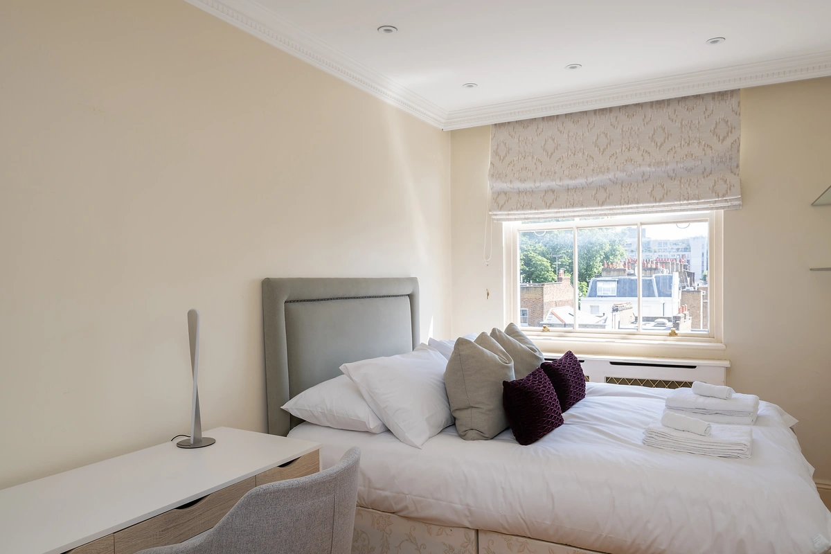 Stylish bedroom with natural light and soft textures