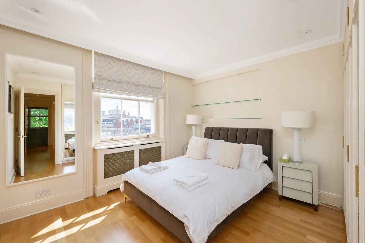 Serene bedroom with luxurious bedding and elegant details