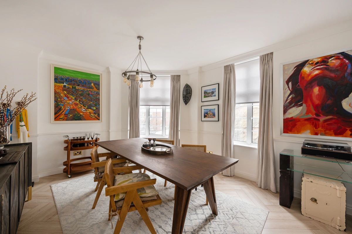 Dining area with a minimalist table and modern chairs
