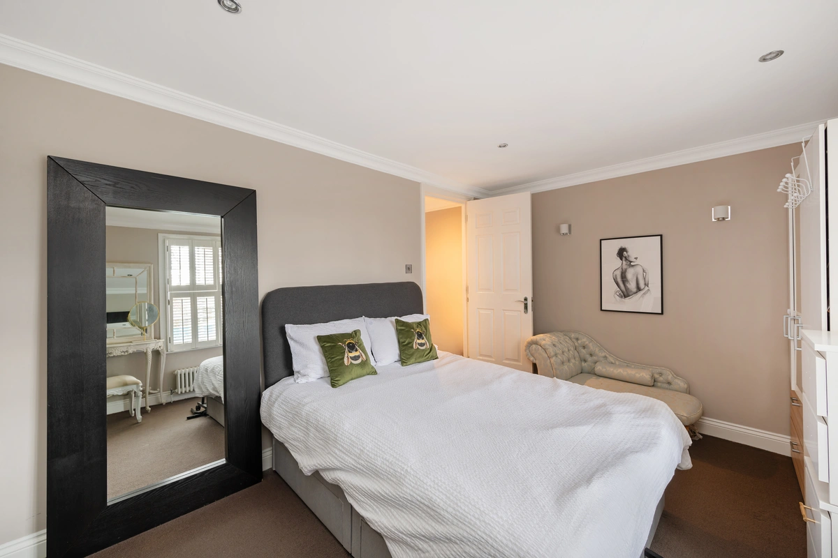 Guest bedroom with soft lighting and stylish furnishings