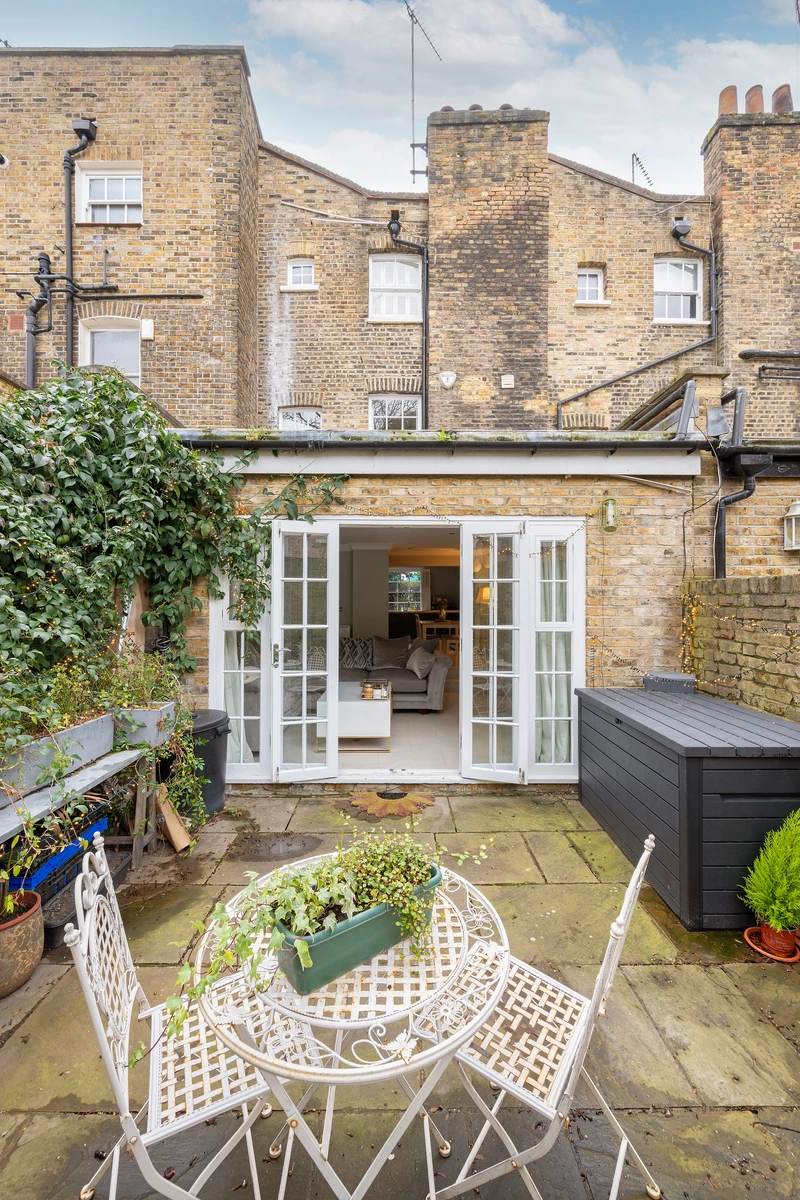 Charming garden illuminated by fairy lights, perfect for outdoor dining