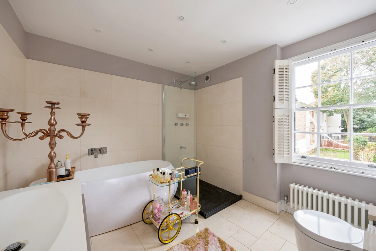 Second bedroom with neutral tones and plush bedding