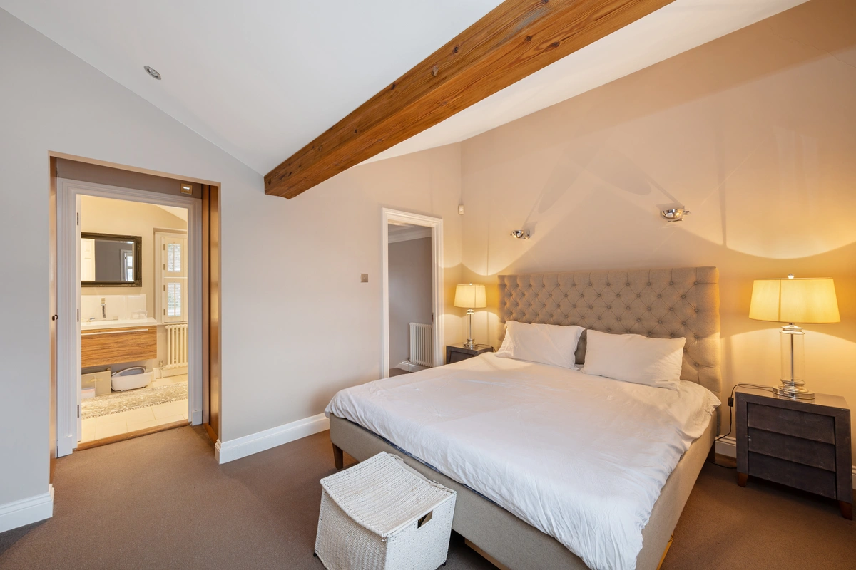 Elegant bedroom with soft lighting and a comfortable atmosphere