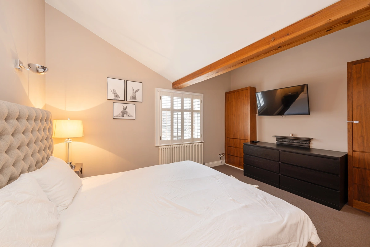 Cozy bedroom with plush bedding and calming decor