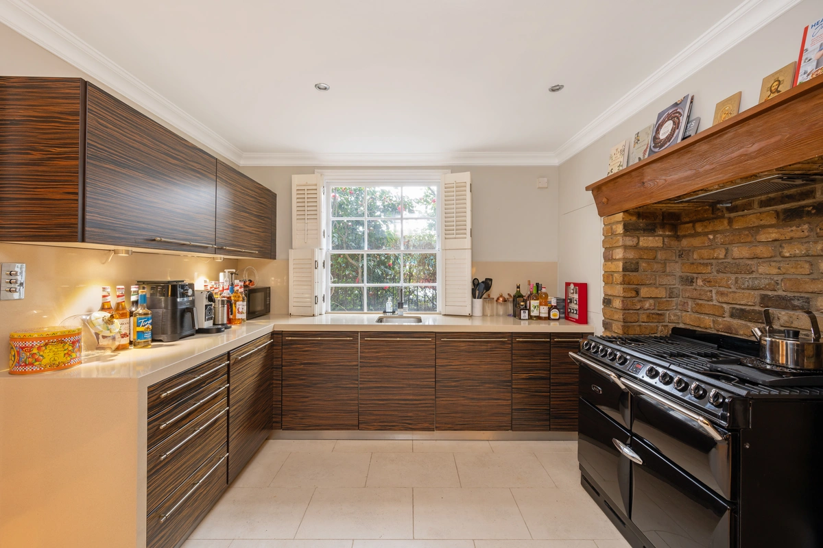 Fully equipped kitchen with sleek countertops and modern appliances