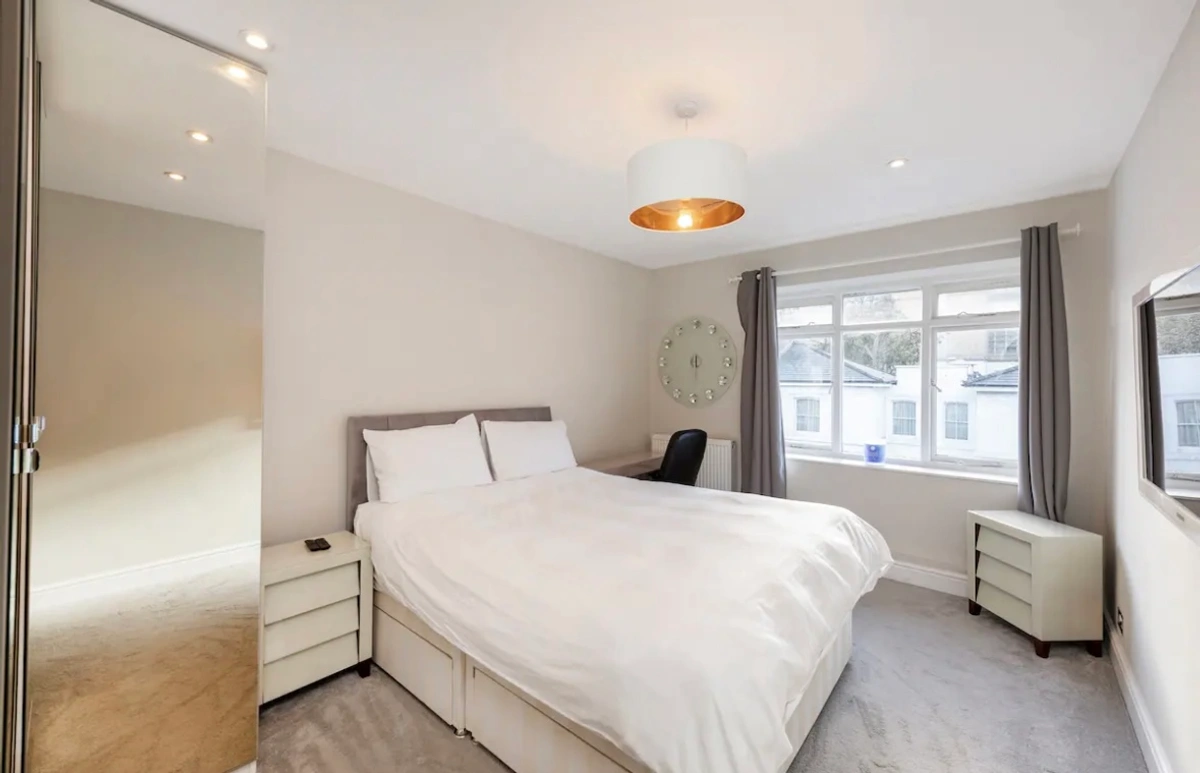 Guest bedroom with comfortable furnishings and chic decor