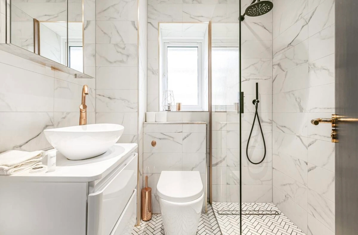 Luxury bathroom with elegant fixtures and glass shower enclosure