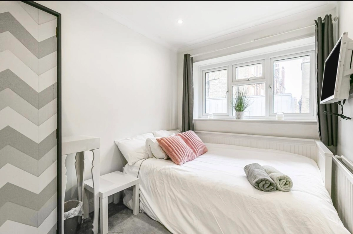 Cozy bedroom featuring elegant decor and a calming ambiance