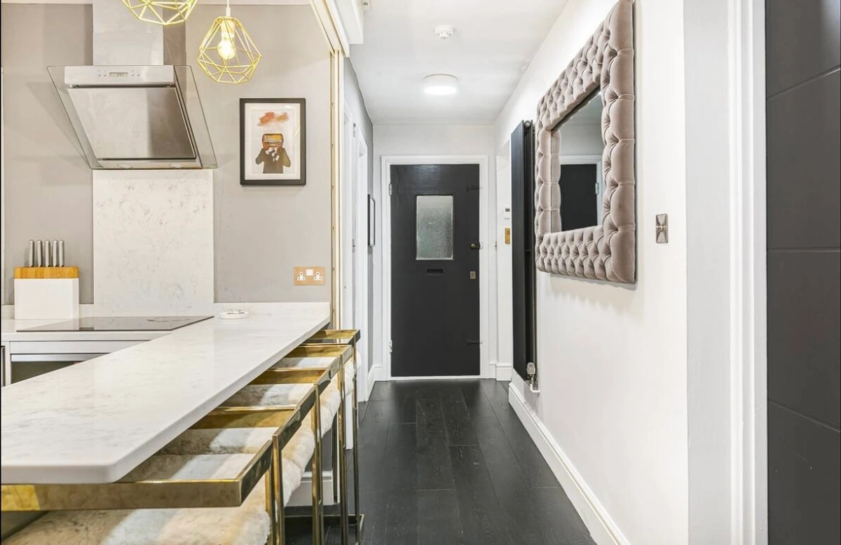 Stylish high table with modern stools in a sleek kitchen area