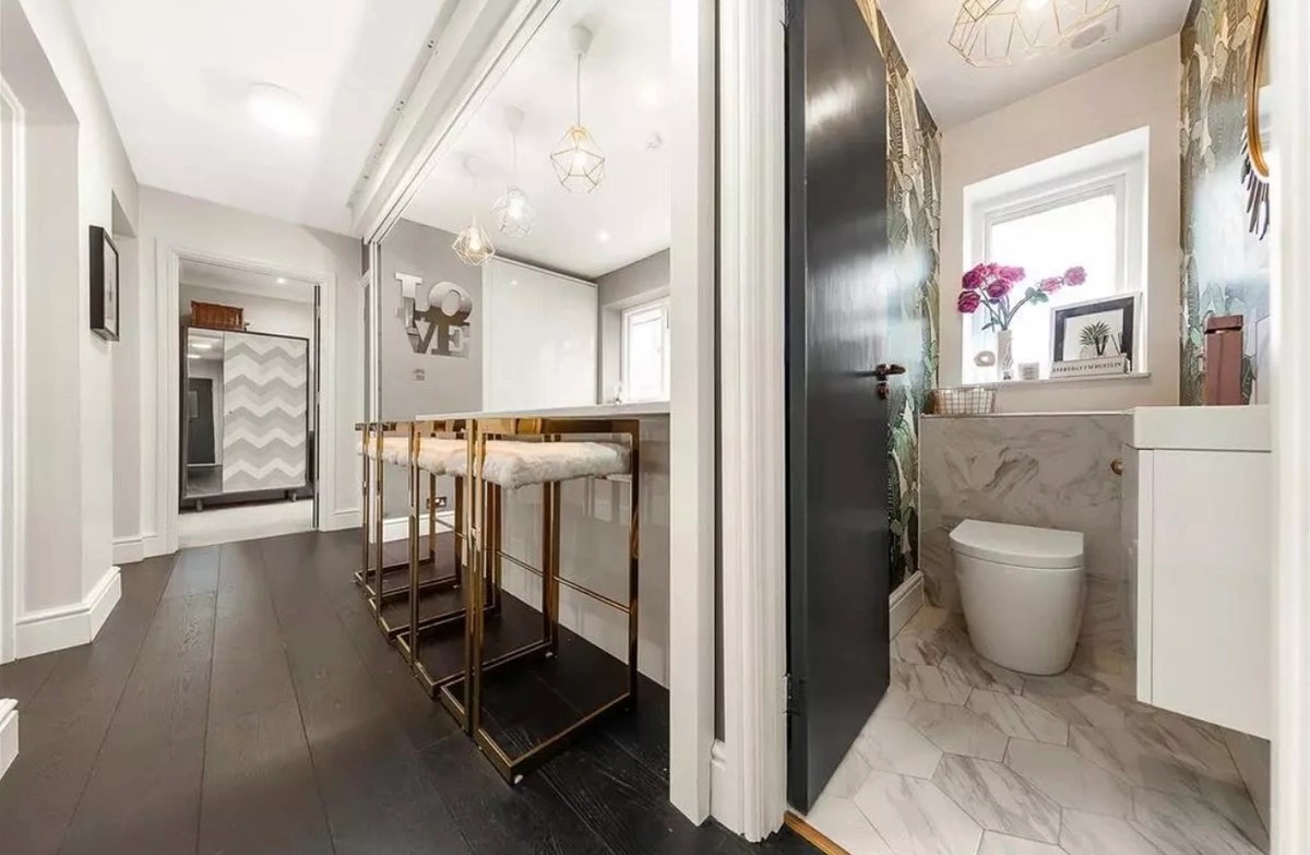 Wide view showcasing the open-plan layout with stylish furniture