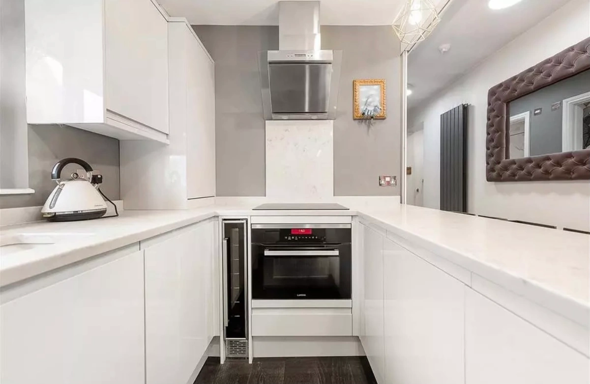Modern kitchen with sleek countertops, high-end appliances, and ample storage