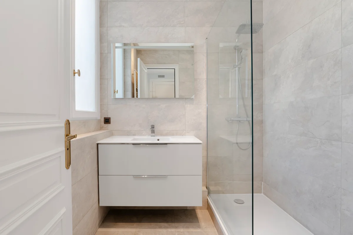 Third angle of the spa-inspired bathroom at Casa Cribs with luxurious finishes and natural light.