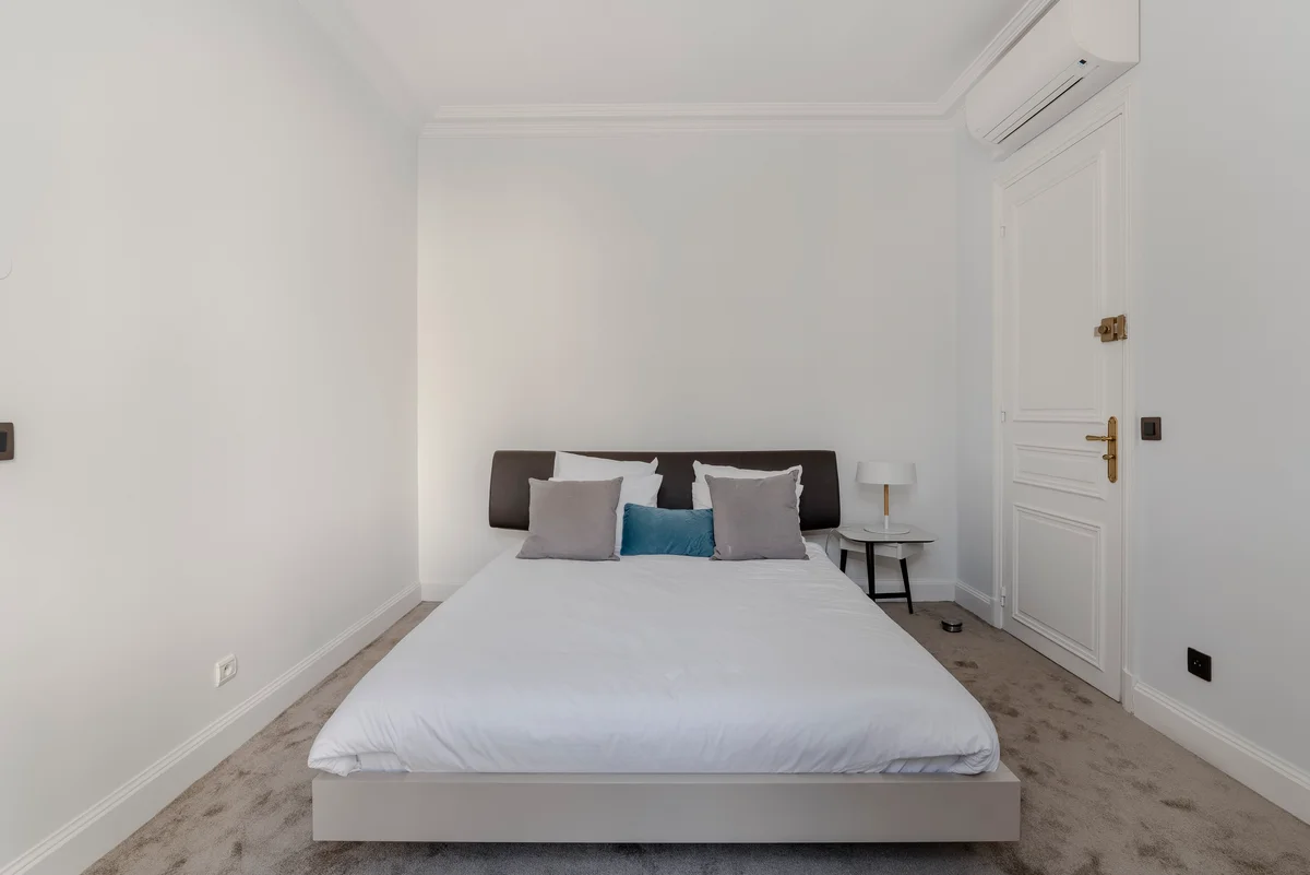 Fourth view of the cozy guest bedroom at Casa Cribs offering refined comfort and style.