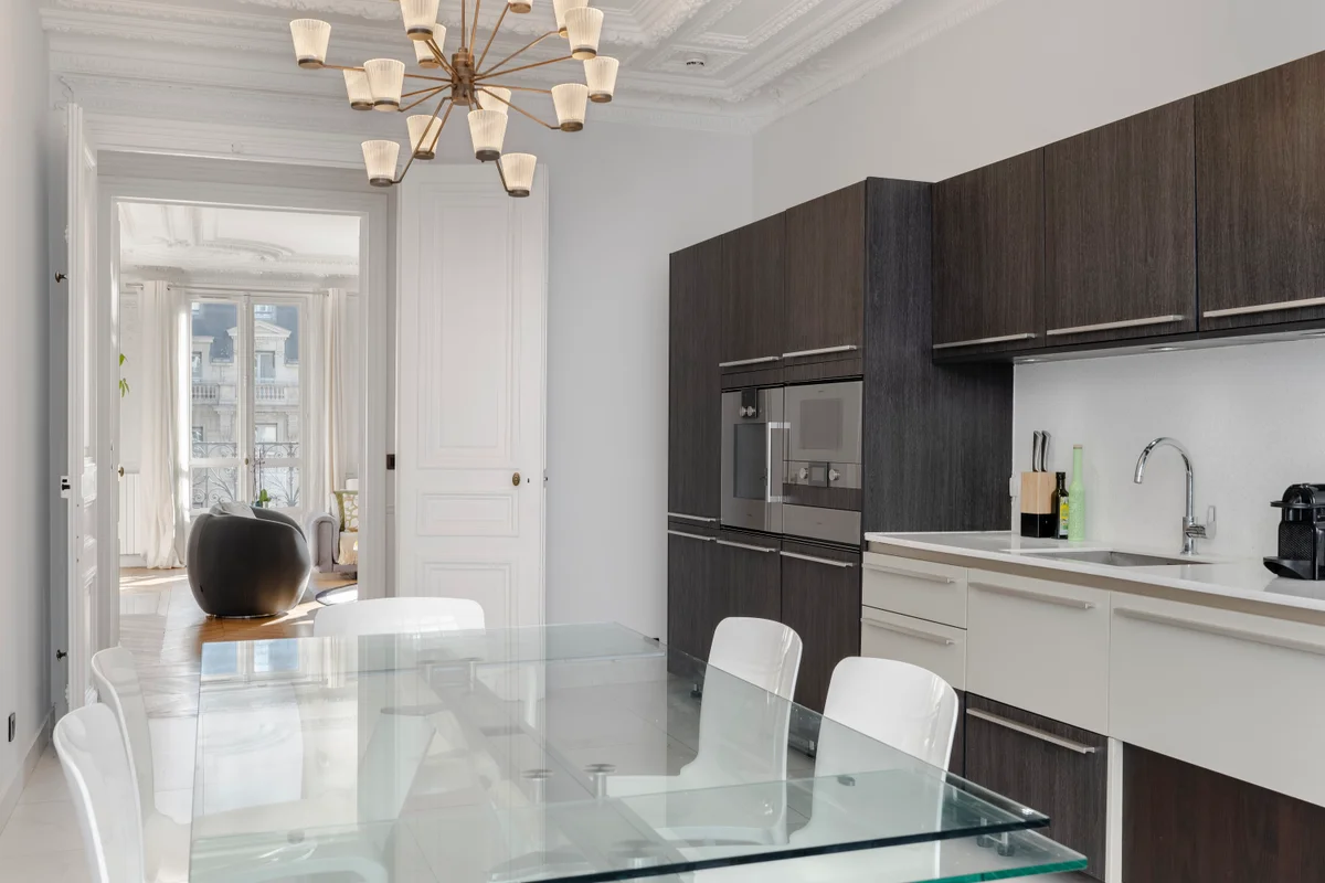 Second angle of the refined kitchen at Casa Cribs showcasing a seamless blend of functionality and style.