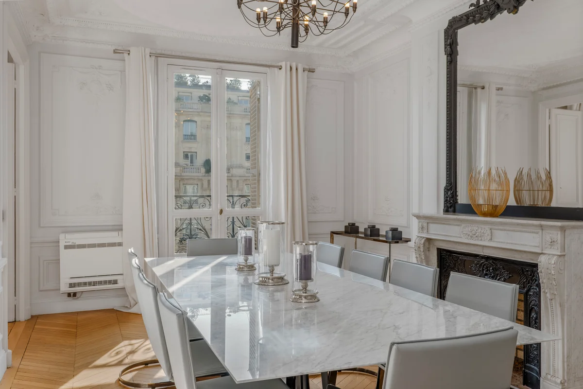 Second view of the stylish dining area at Casa Cribs blending comfort and Parisian sophistication.
