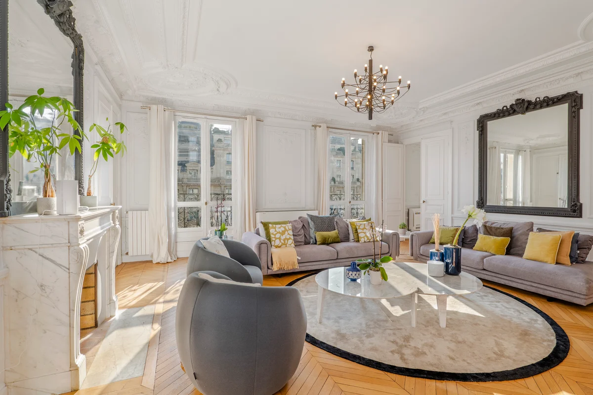 	Elegant living room at Casa Cribs with designer furnishings and classic Parisian style.