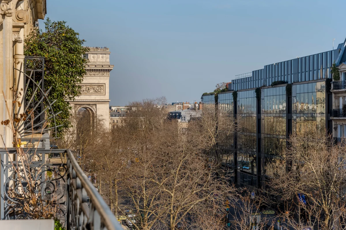 Private balcony at Casa Cribs with charming Parisian views and classic ironwork.