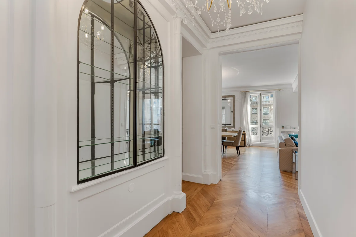 Another view of the bright corridor at Casa Cribs connecting the elegant living spaces.