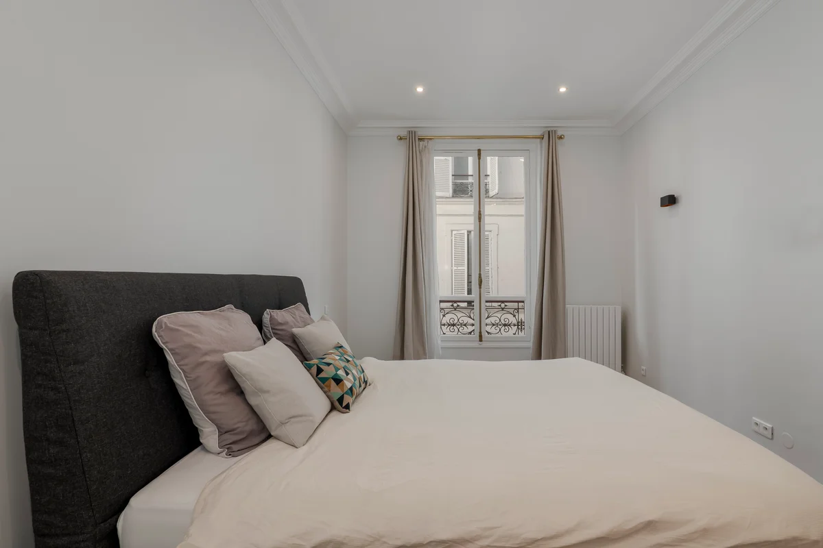 Sixth angle of the elegant bedroom at Casa Cribs highlighting soft linens and natural light.
