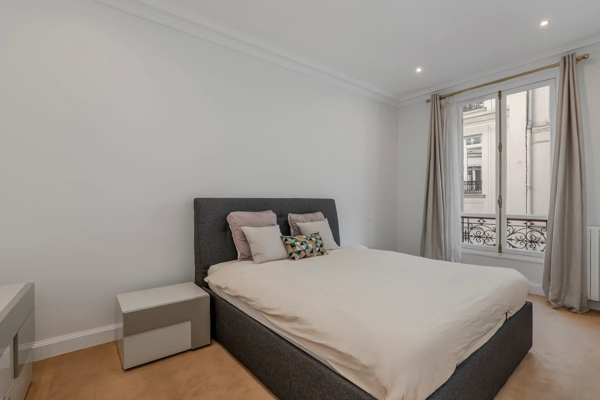 Fifth view of the inviting bedroom at Casa Cribs with refined furnishings and classic Parisian charm.