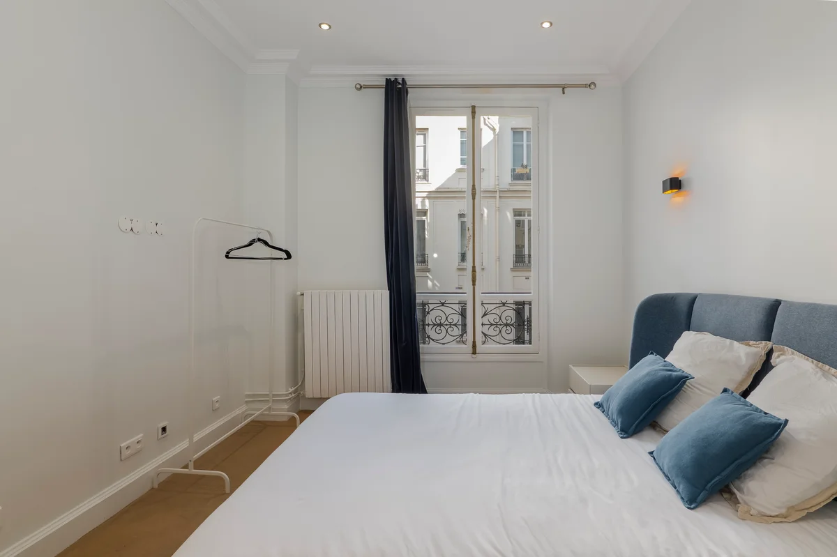 Fourth view of the spacious bedroom at Casa Cribs designed for restful sleep and relaxation.