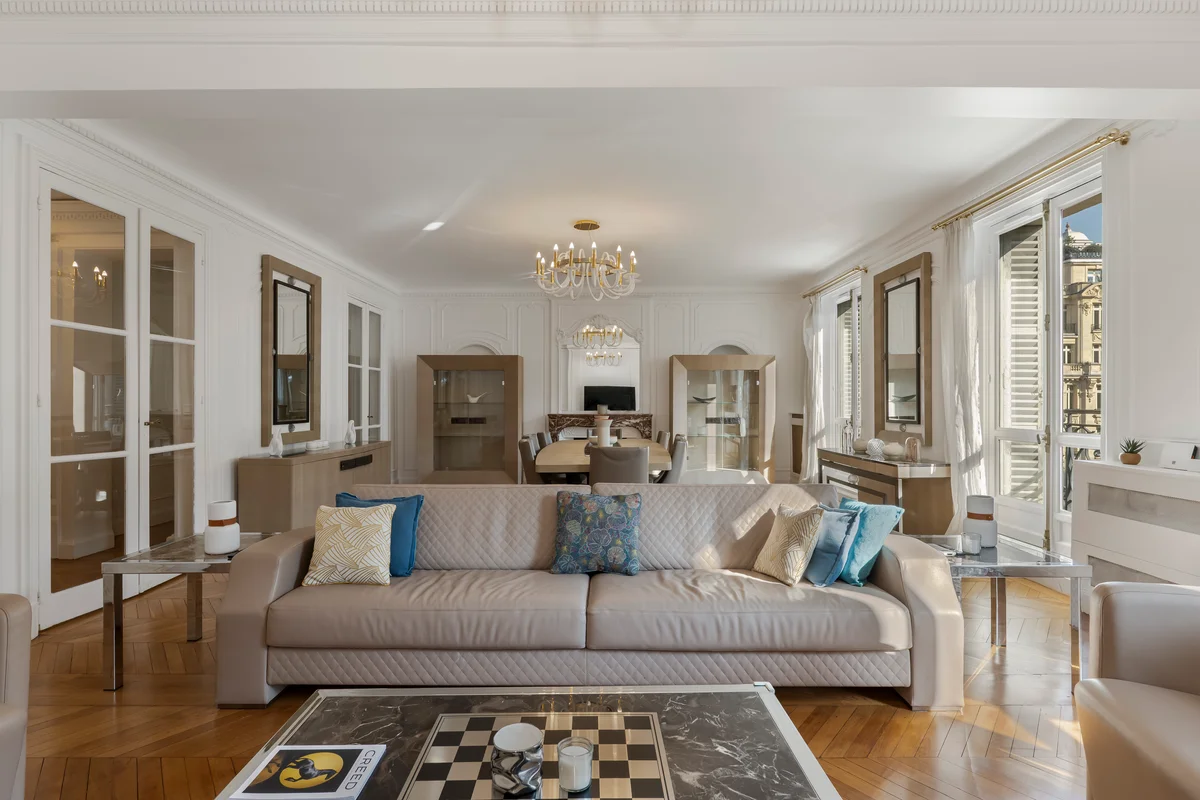 Plush sofa in the living area at Casa Cribs offering comfort and classic Haussmannian style.