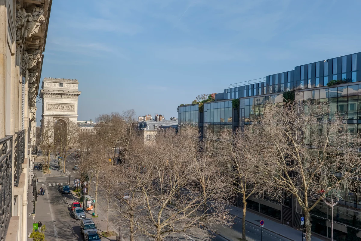 Stunning view from the Casa Cribs apartment capturing Parisian rooftops and city life.