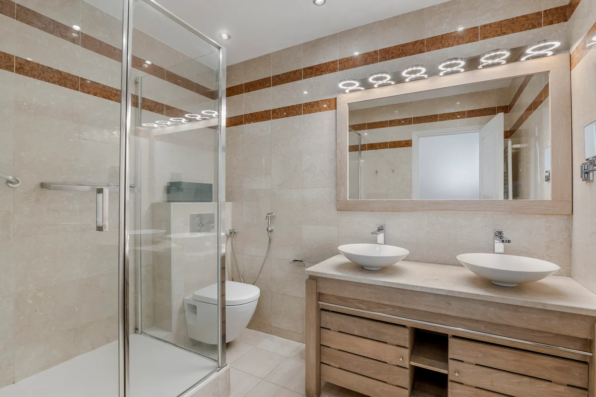 Luxurious bathroom at Casa Cribs featuring modern fixtures and marble finishes.