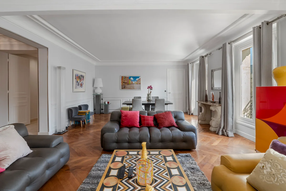 Cozy sofa at Casa Cribs offering comfort and modern Parisian elegance.