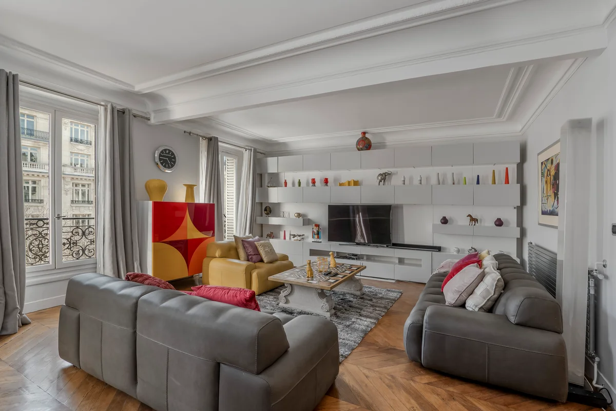 Spacious living room at Casa Cribs with plush designer sofas and stylish decor.