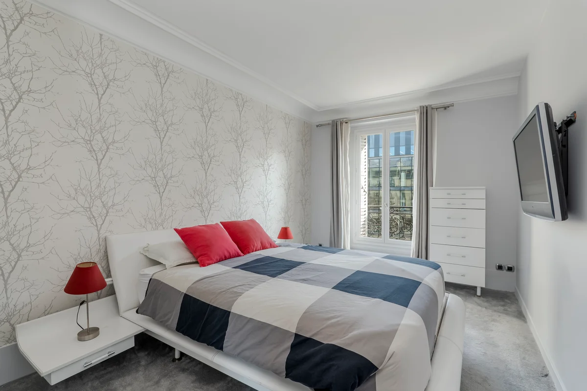 Close-up of the plush bed at Casa Cribs with soft linens and elegant finishes.