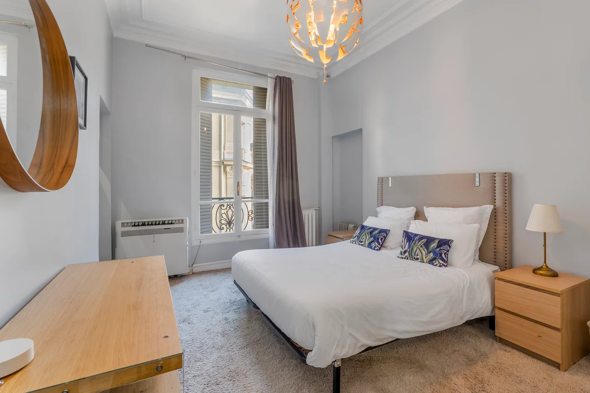 	Comfortable bedroom at Casa Cribs with a plush bed and sophisticated decor.