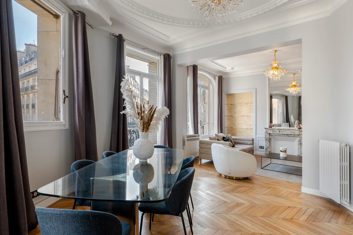 Open-plan dining area and kitchen at Casa Cribs designed for elegant entertaining.