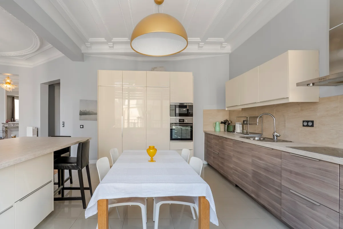 Open-plan dining area and kitchen at Casa Cribs designed for elegant entertaining.
